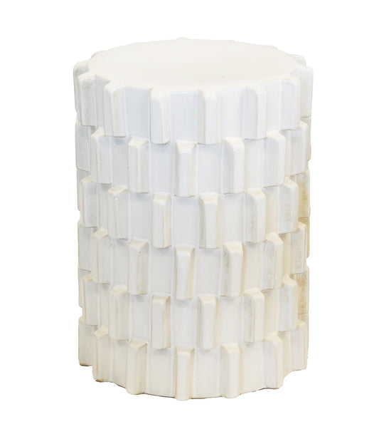 A white cylindrical side table or stool with a textured, block-like geometric pattern, shown against a plain white background.