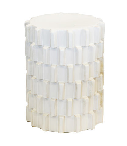 A white cylindrical side table or stool with a textured, block-like geometric pattern, shown against a plain white background.