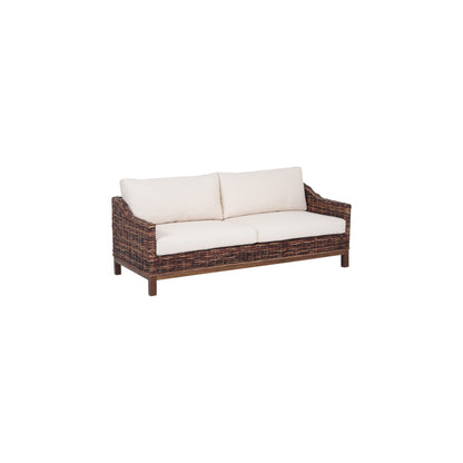 Wicker outdoor sofa with white cushions on a white background