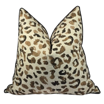 Pair of leopard print pillows on a white background