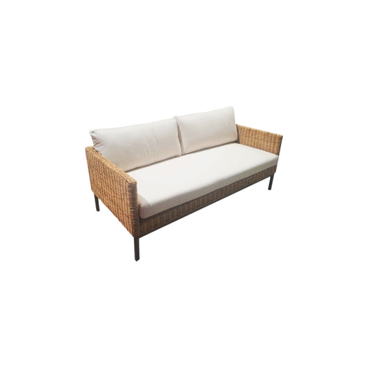 Wicker outdoor sofa with white cushions on a white background