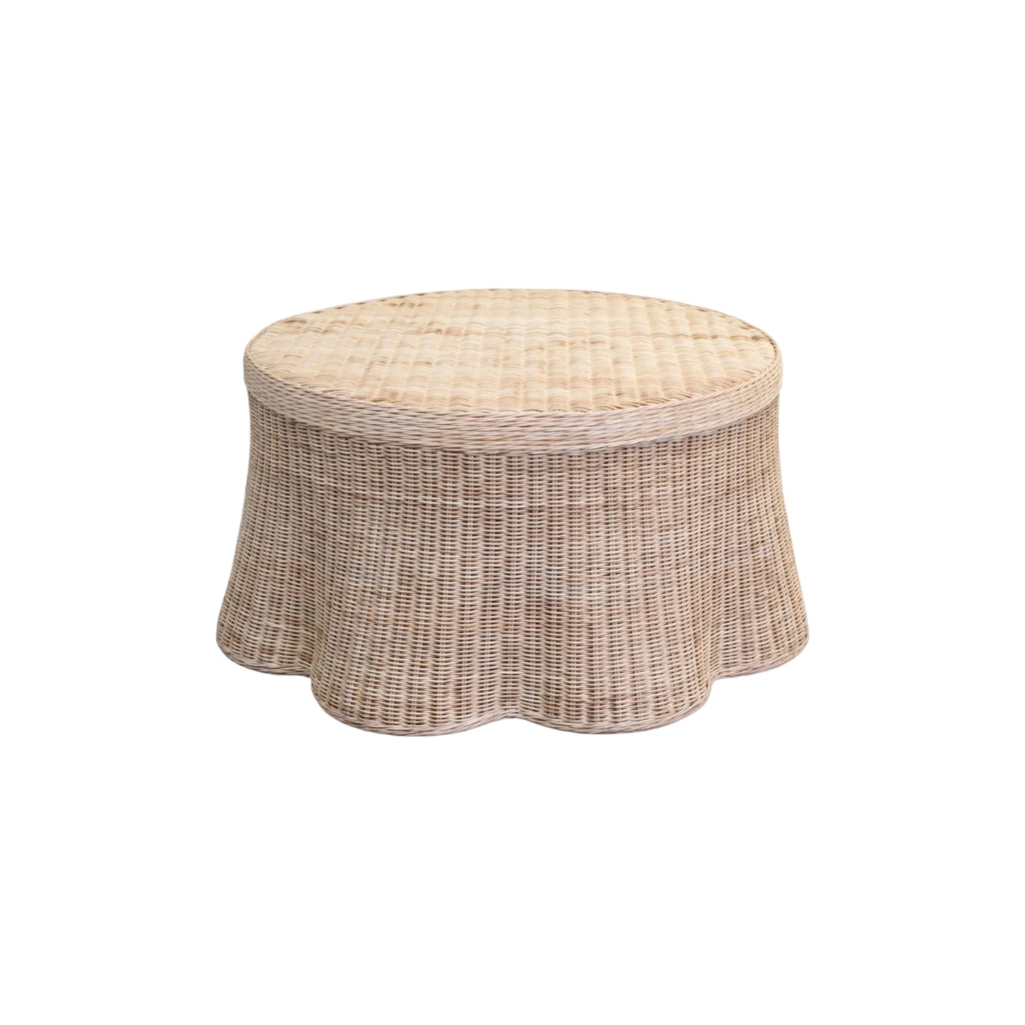 Wicker ottoman with a beige cushion on a white background