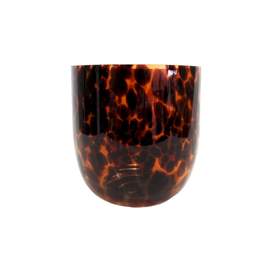 Tortoiseshell patterned glass on a white background