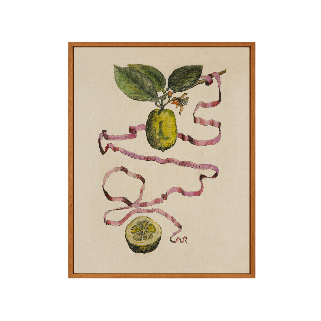 Framed artwork of a botanical illustration with green leaves and ribbons on a beige background